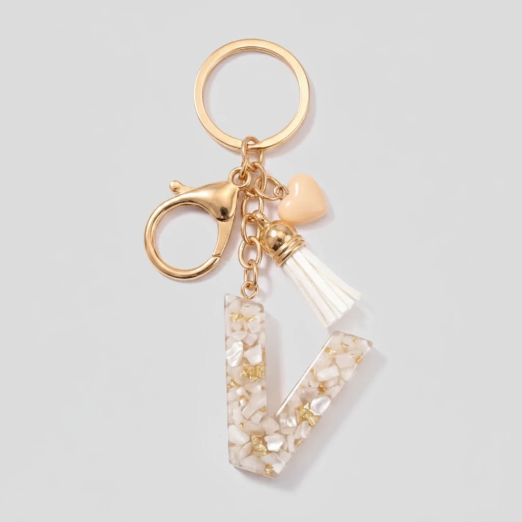Porte-clés beige avec initiales, lettre V